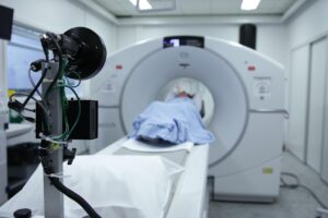 Healthcare professionals using technology for diagnostics and treatment.